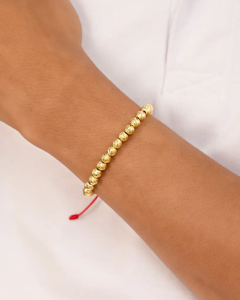 15 10 PULSERA MUCHOS BALINES HILO ROJO.webp