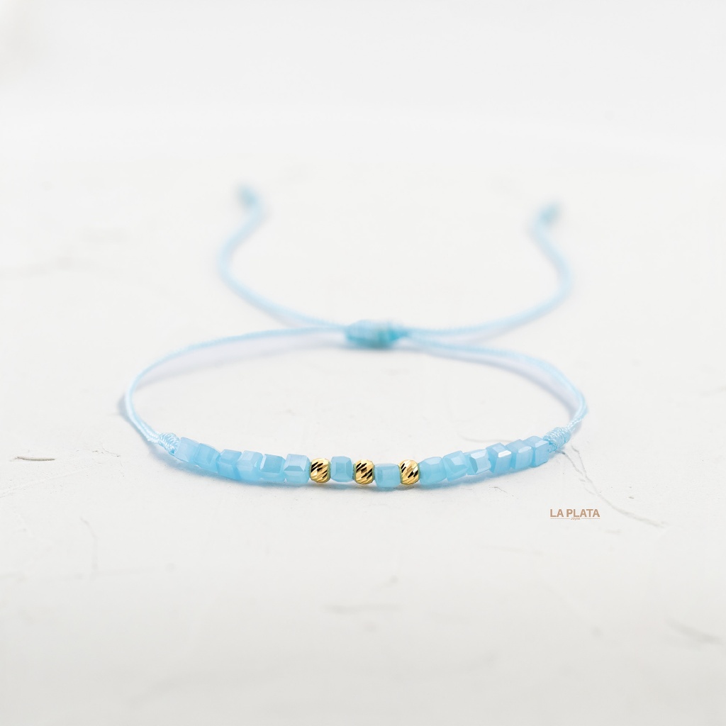 PULSERA DE HILO TRILUZ